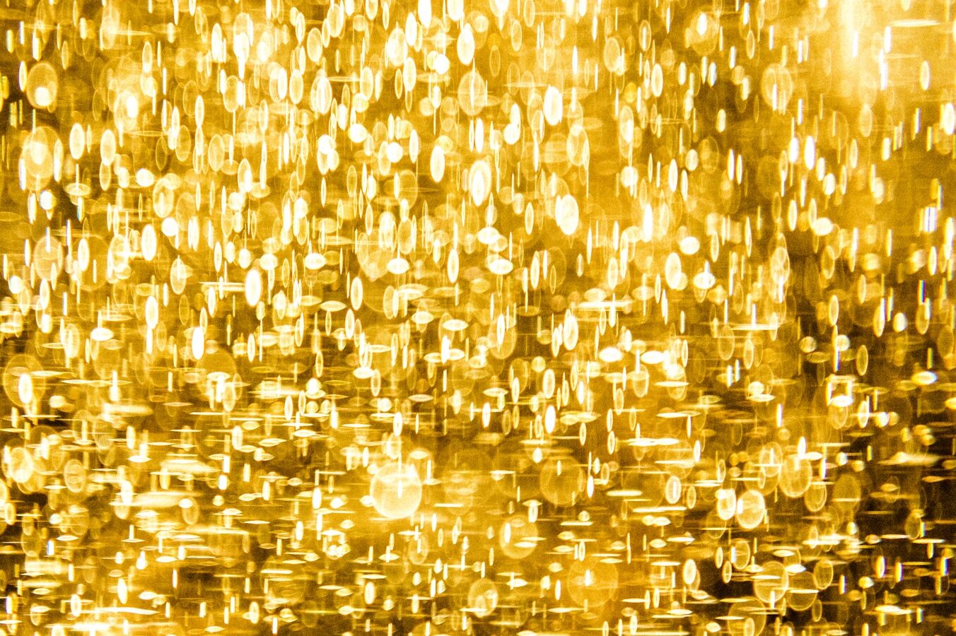a yellow background with lots of small circles